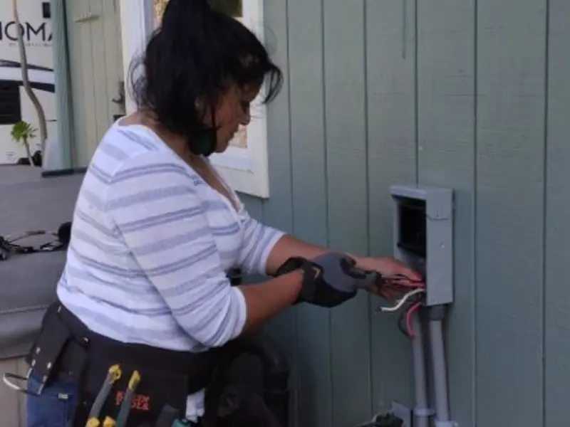Licensed electrician wiring an exterior subpanel in Estacada