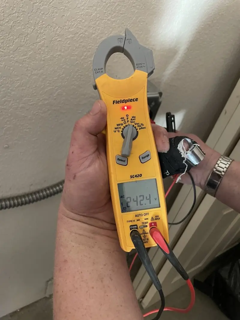 Voltage testing with clamp meter during Electrical Installation Services in Estacada